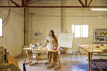 Creative artist working in a spacious studio with natural light