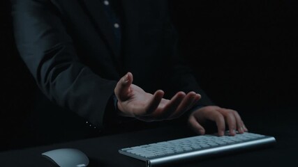 A businessman interacts with a digital interface displaying futuristic graphics and data analysis over his hand, symbolizing innovation and technology in the workspace. Qubit - Powered by Adobe