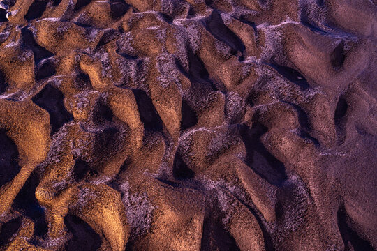 Volcanic Sand Texture at Sunset