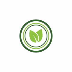 Green organic leaf badge in circle for eco friendly natural product environmental sustainability or healthy certification branding
