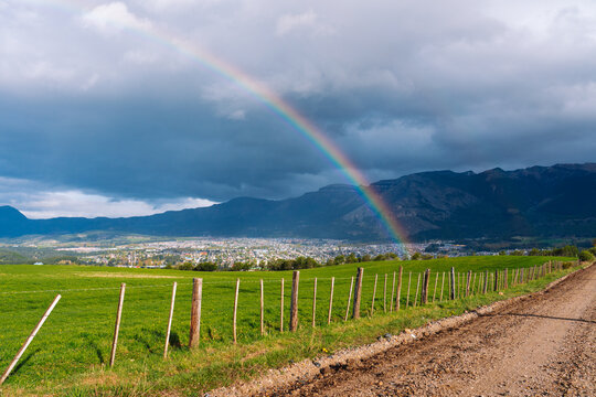 Rainbow over green pasture 