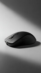 Sleek Wireless Mouse on a Light Gray Surface with Shadow.