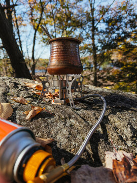 Coffee pot heating on portable camping stove