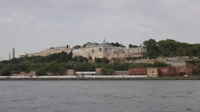 Historic buildings of Hagia Sophia and Topkapi Palace on a hillside overlooking water in Istanbul, Turkey.