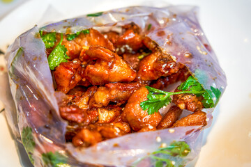 Sweet and rich flavor of paper-wrapped pork ribs, a traditional dish from Guangxi, China