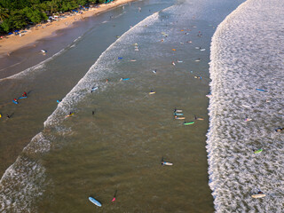 Aerial view of Weligama Beach with surfers riding the waves, Sri Lanka