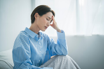 体調不良の女性