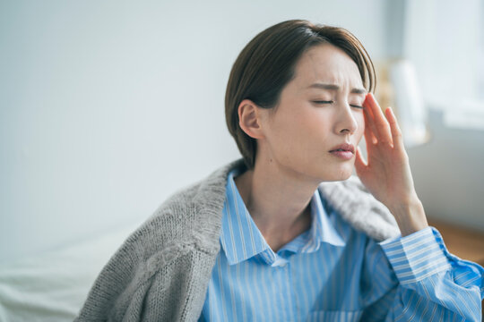 体調不良の女性