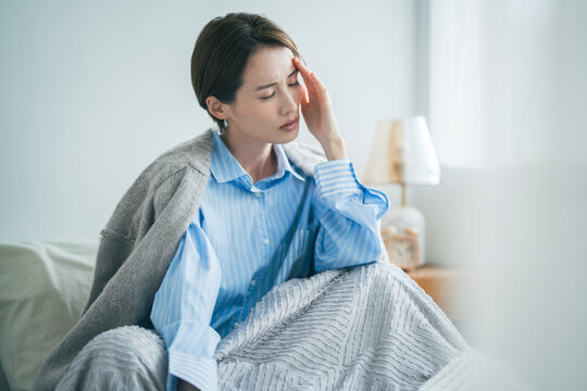 体調不良の女性