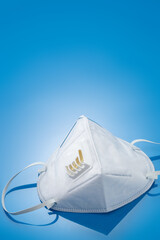 N95 Protective Mask with Exhalation Valve on Blue Background