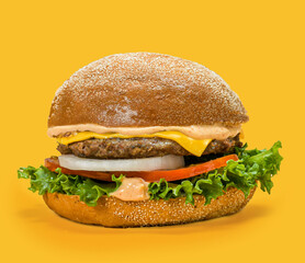 Close-Up of Gourmet Beef Cheeseburger with Lettuce, Tomato, Onion and Melted Cheese — Side View on Bright Yellow Background, Fast Food Advertising Concept