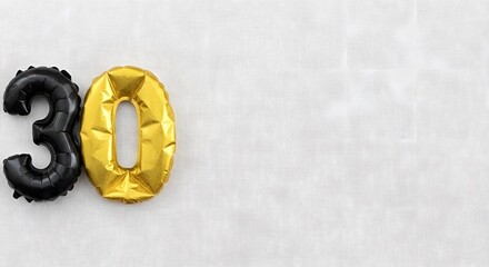 Number thirty balloons on textured white background for thirtieth birthday