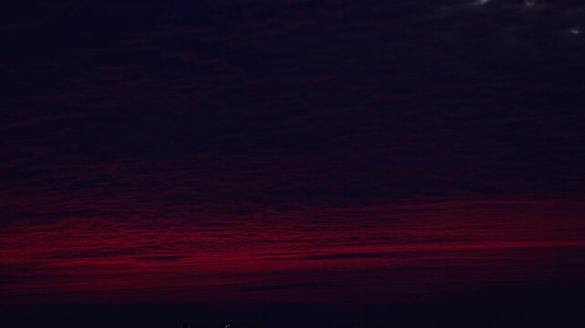 Dramatic Sunset Sky with Vibrant Red Clouds and Golden Hour Light