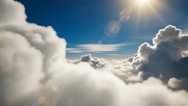 Sunlight Breaks Through Fluffy White Clouds Over Blue Sky Aerial View