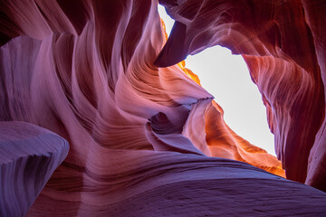 Antelope Canyon offers a breathtaking view with its vibrant rock formations and narrow passageways on Arizonas Indian reservation. The place is a mustvisit for adventure seekers. Popular place in USA.