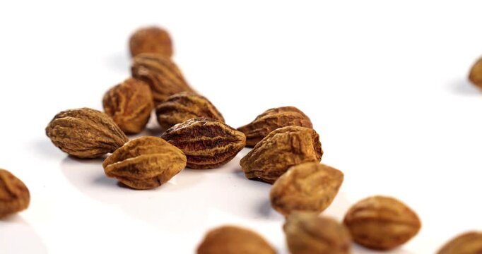 Dried Haritaki Ayurvedic Fruit on Rustic Background &ndash; Traditional Indian Herbal Medicine Ingredient for Health and Wellness