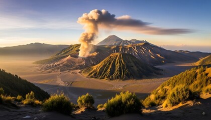 Obraz premium Dramatic volcano erupting with smoke against a mountain landscape at sunset