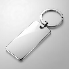Blank silver rectangle shaped keychain with ring on gray background