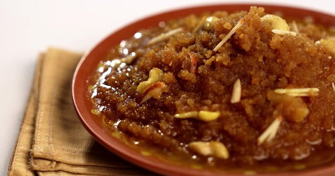 Moong dal halwa is a classic Indian sweet dish made with moong lentils, sugar, ghee and cardamom powder