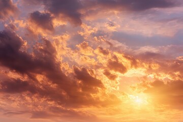 Obraz premium Majestic sunrise illuminates the sky with vibrant orange hues and dramatic clouds in the tranquil early morning light