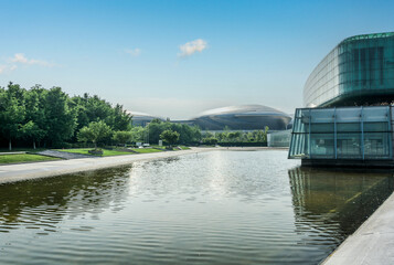 Stunning Modern Architecture Reflected in Tranquil Waters of a Serene Urban Landscape