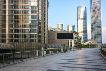Modern Urban Skyline with Tall Glass Buildings and Walkway