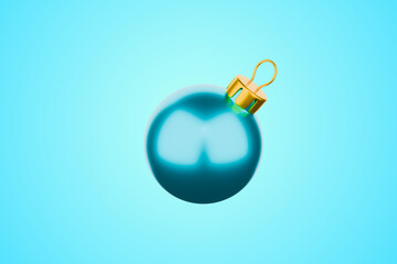 Bright blue glass Christmas bauble ornament isolated on a light blue background
