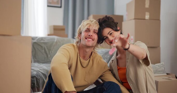 New home, boxes and face of couple with keys for moving in, property purchase and relocation. Homeowner, love and portrait of happy man with woman with keychain for house, real estate and mortgage