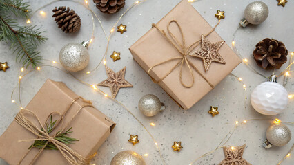 Festive gift packages arranged with ornaments and decorations on a light background celebrating the holiday spirit