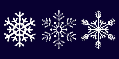 Three hand drawn white snowflakes on dark blue background