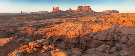 Sunset at Monument Valley Navajo Tribal Park in Arizona and Utah, United States of America. Sandstone towers illuminated by the sun. The most popular place in Utah. Summer time and summer season © Michal