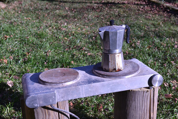 Moka pot and portable electric stove outdoors