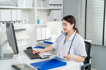 Asian female doctor use laptop give medical advice to a patient online. 