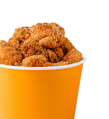 Crispy fried chicken in a bright orange container ready for serving