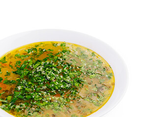 Delicious homemade soup garnished with fresh herbs in a white bowl