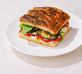 Delicious sandwich made with fresh ingredients on a white plate