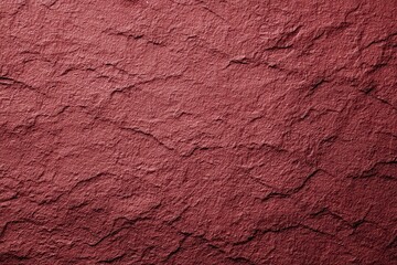 Fototapeta premium Dark red textured wall or paper background exhibits a rich grain pattern ideal for artistic or design use in various projects and creative settings