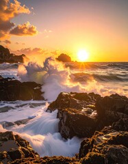 Fototapeta premium Dramatic ocean waves crash against rocky coastline during a vibrant sunset.