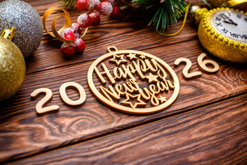 Happy new year 2026 on wooden brown background
