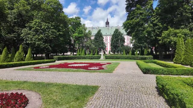 Walking in the park around Parish Church of St. Stanislaus (Fara Church) in poznan, Poland