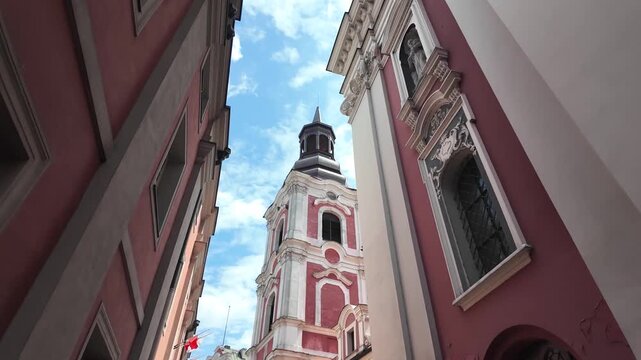 Walking towards Parish Church of St. Stanislaus (Fara Church) in poznan, Poland