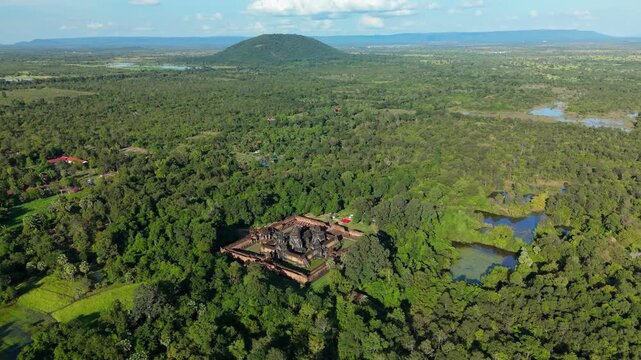 A high-altitude aerial orbit left shows Banteay Samre Temple surrounded by expansive forest and wetlands in the Siem Reap