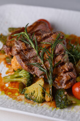 beef medallions with vegetables in sauce