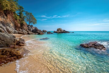 Fototapeta premium Explore the serene tropical beach of Phuket, Thailand, with crystal-clear waters, smooth sands, and rocky formations under a bright blue sky