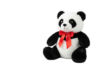 Oversized cute plush panda bear with glossy button eyes and a bright red satin bow, on a transparent studio background with copy space, adorable innocence and gift concept