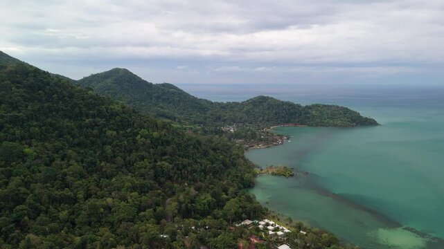 Aerial drone footage capturing the tranquil Bailan Village, beach, and tropical resorts on Koh Chang, Thailand