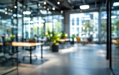 Abstract office interior background. Blurry office space. Modern workspace design. Glass walls, blurred furniture, plants. Natural light, commercial building, business concept, indoor. High quality