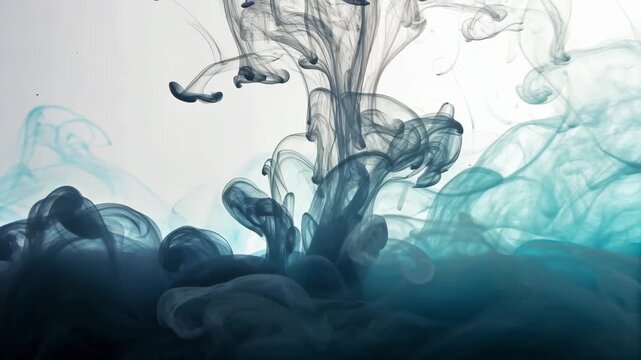 Dark grey and teal ink clouds spreading in water creating swirling patterns against a light background