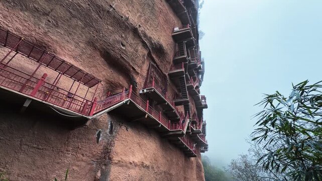 Walkway With Series Of Rock-cut Caves At Maijishan Grottoes In Tianshui, Gansu Province, China. Low Angle Shot
