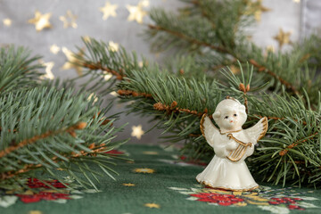 Christmas delicate ceramic angel figurine with small harp